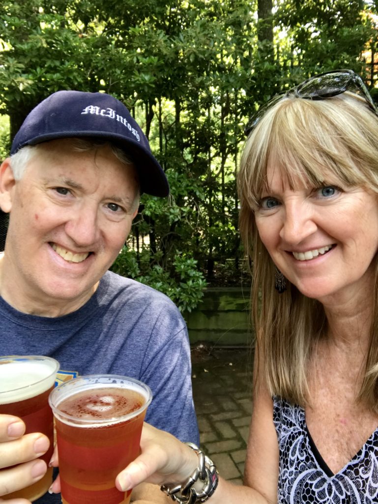 Man and woman drinking beers in Central Park