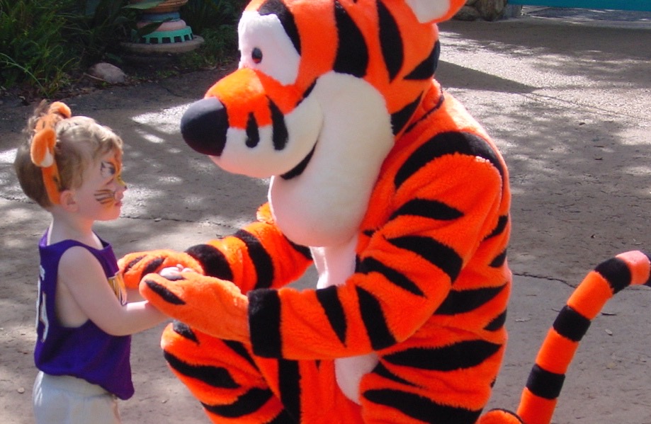 Things to do in Orlando Disney World boy getting Tigger autograph