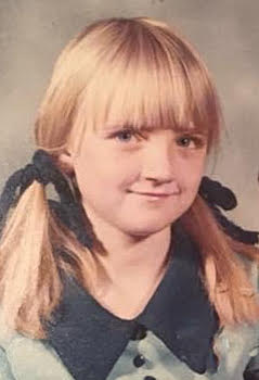 girl with blonde hair and pigtails